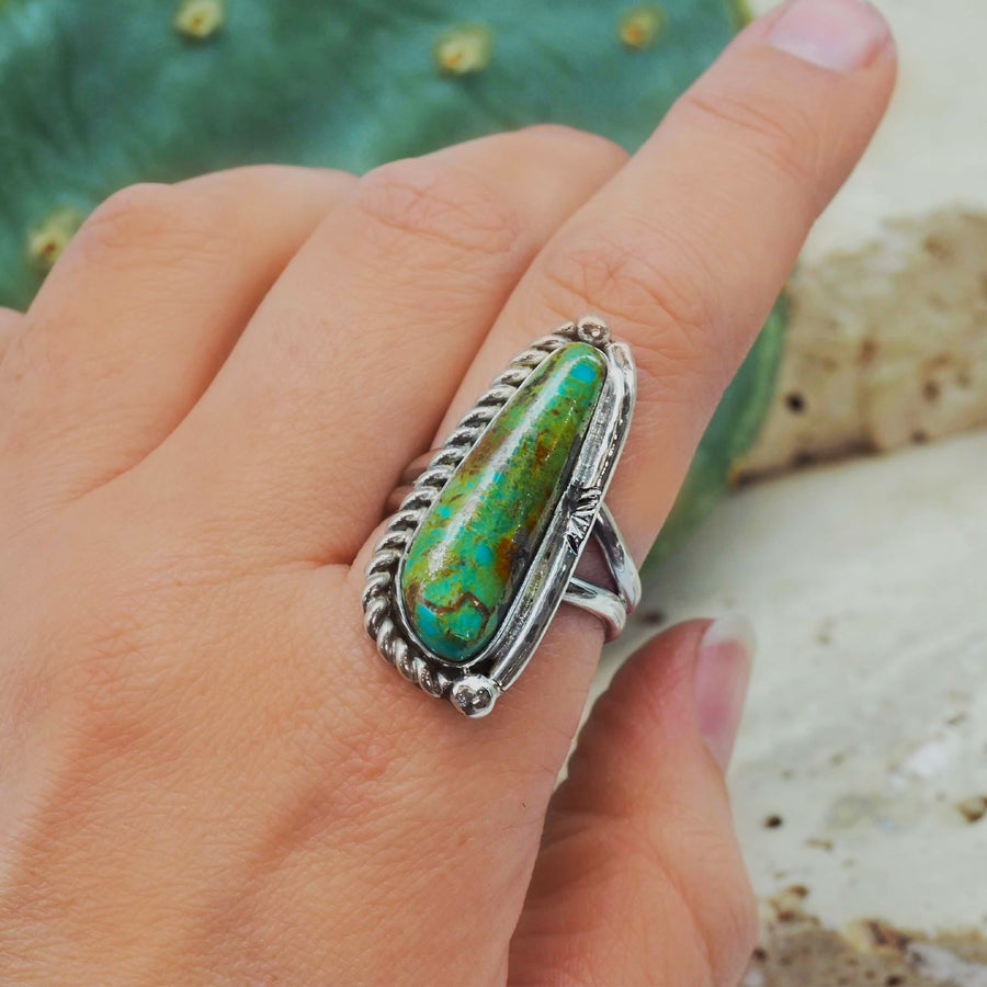 finger wearing turquoise ring with green, blue and brown colours - womens turquoise jewellery by australian jewellery brand indie and harper