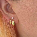 gold earrings set being worn