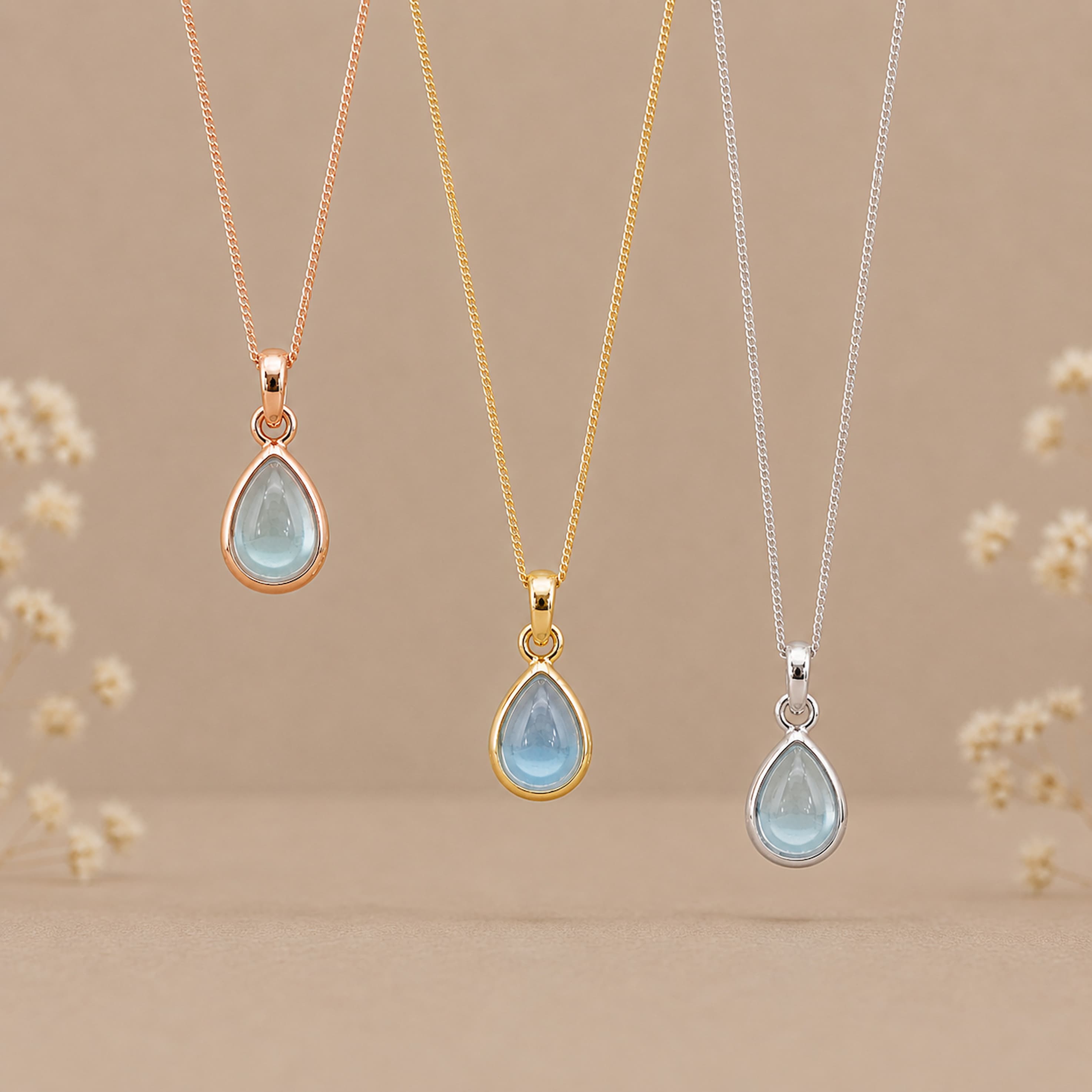 three november birthstone natural blue topaz pear-shaped pendant necklaces in rose gold, gold and silver
