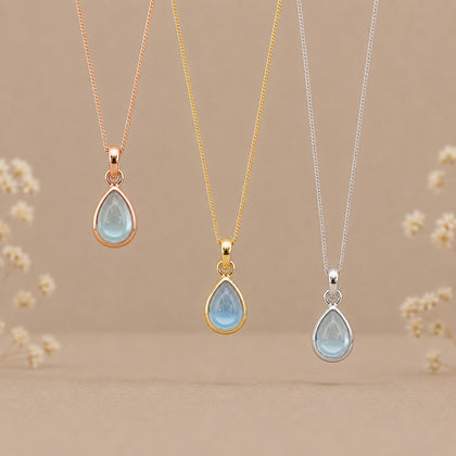 three november birthstone natural blue topaz pear-shaped pendant necklaces in rose gold, gold and silver