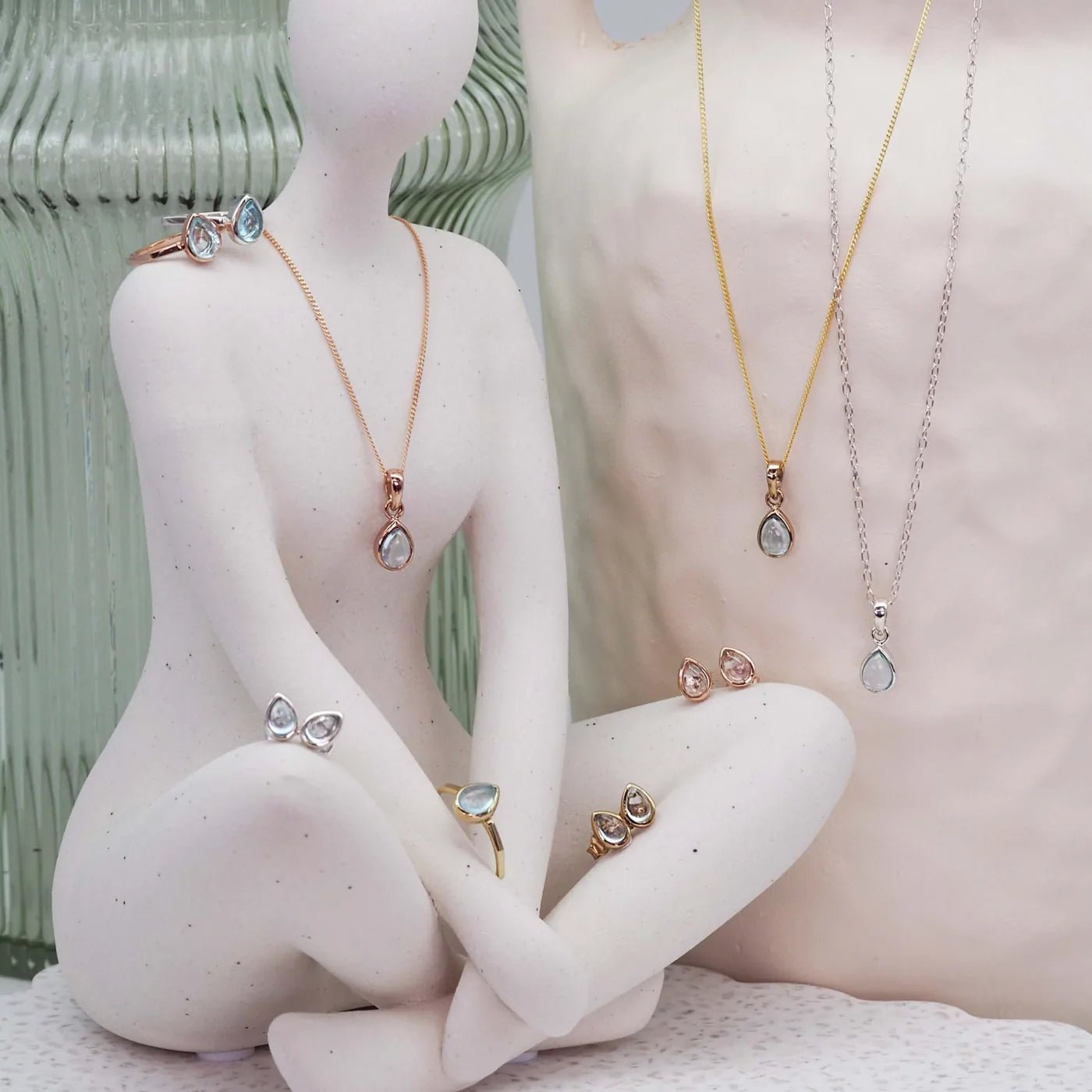 group shot of november birthstone jewellery with natural blue topaz gemstones by indie and harper australia