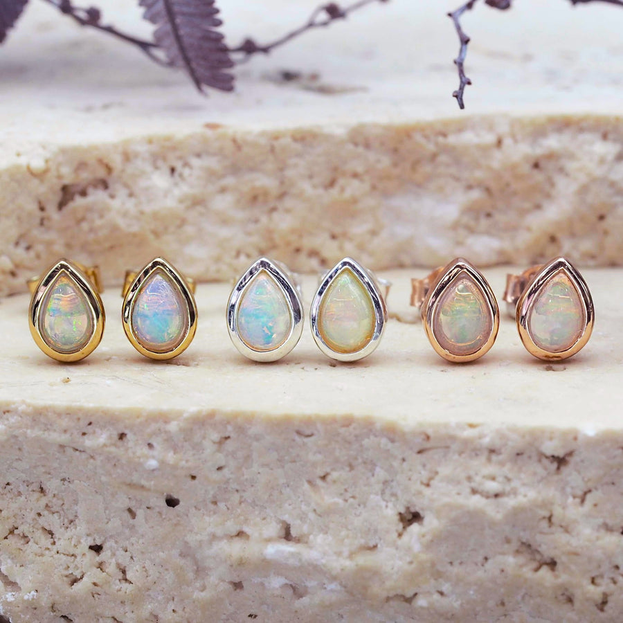 october birthstone earrings made with genuine opals and shown in gold, silver and rose gold