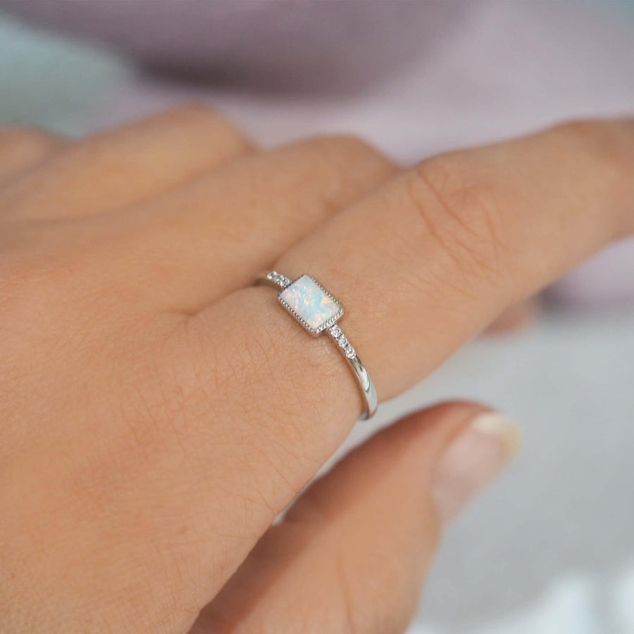 Finger wearing an Opal Ring - womens opal jewellery