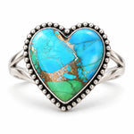 Peacock Dahlia turquoise heart ring, alternate blue and green stone with gold-coloured matrix, front view on white
