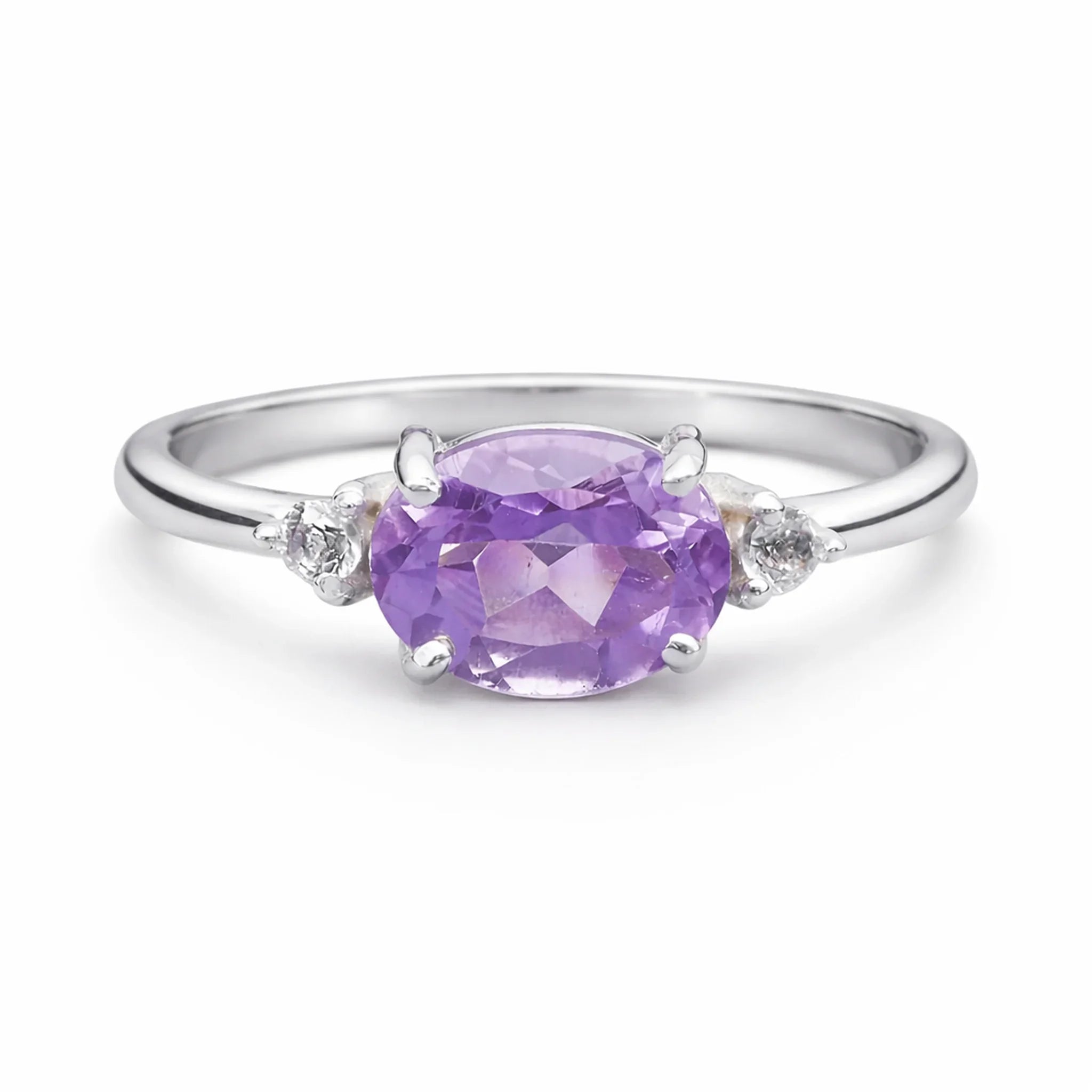 Silver ring with a purple pink amethyst and white topaz accent gemstones on a white background