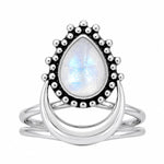 Pear-shaped rainbow moonstone crescent ring in polished sterling silver on a white background
