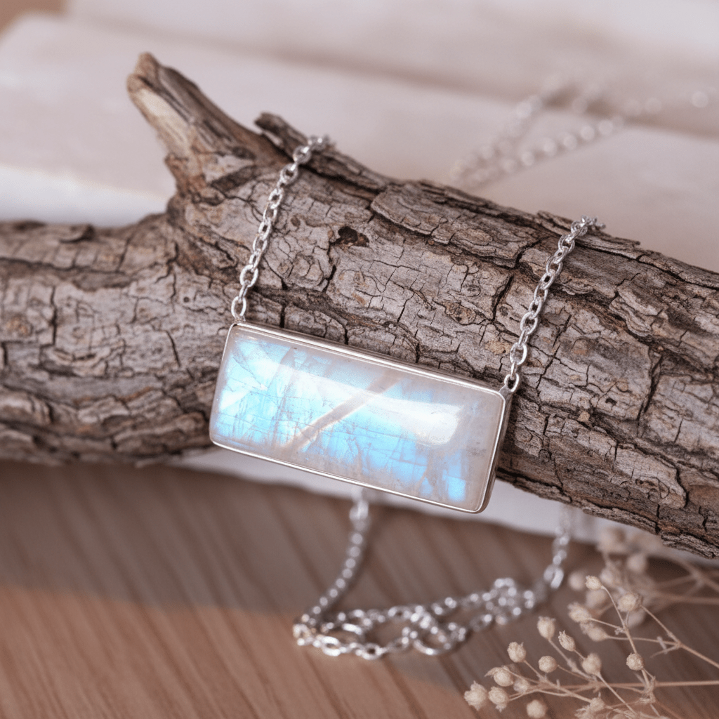 sterling silver Necklace with a rectangular rainbow moonstone pendant on a wooden branch