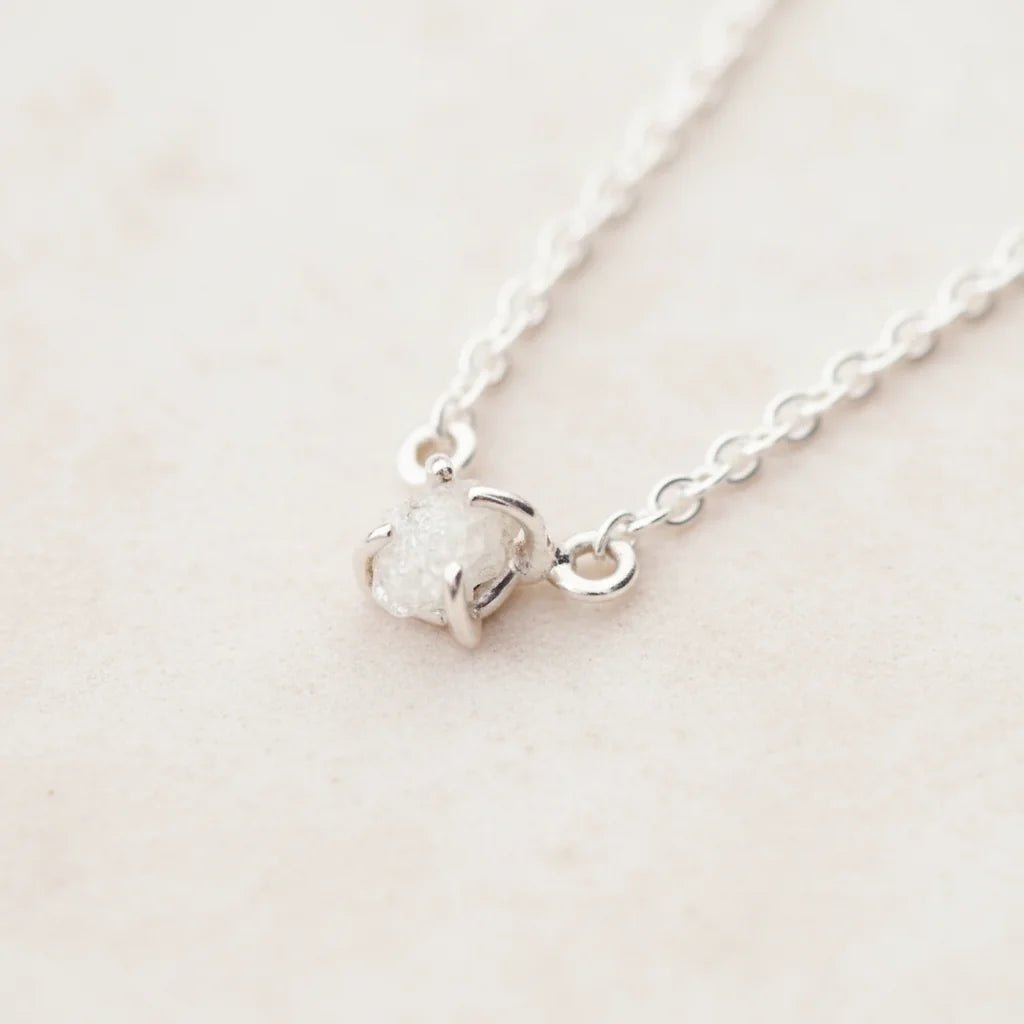 Sterling Silver Raw White Diamond Necklace on a light surface
