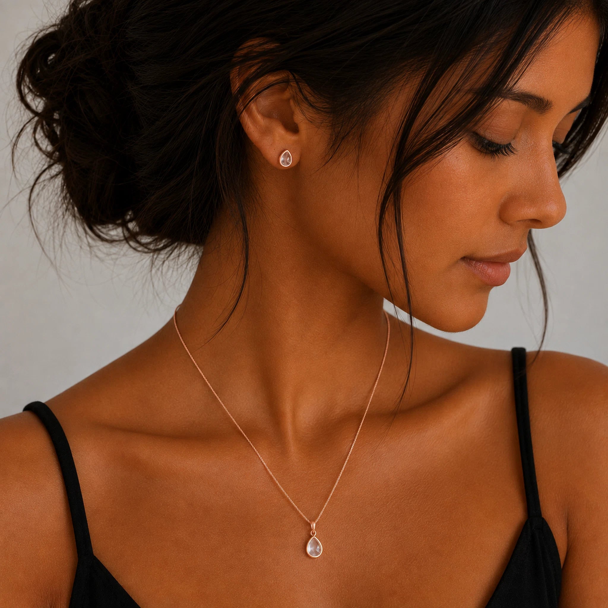 Model wearing a Rose Gold April Birthstone Jewellery set featuring Clear Quartz Stud Earrings and matching Clear Quartz pendant necklace