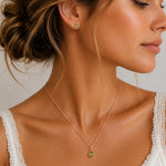A woman wearing Rose Gold August Birthstone Peridot Jewellery Set featuring natural peridot earrings and matching peridot necklace.