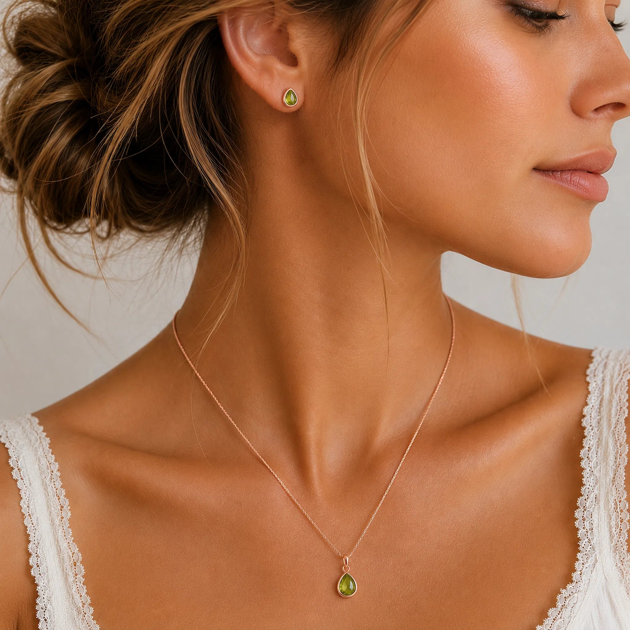 A woman wearing Rose Gold August Birthstone Peridot Jewellery Set featuring natural peridot earrings and matching peridot necklace.