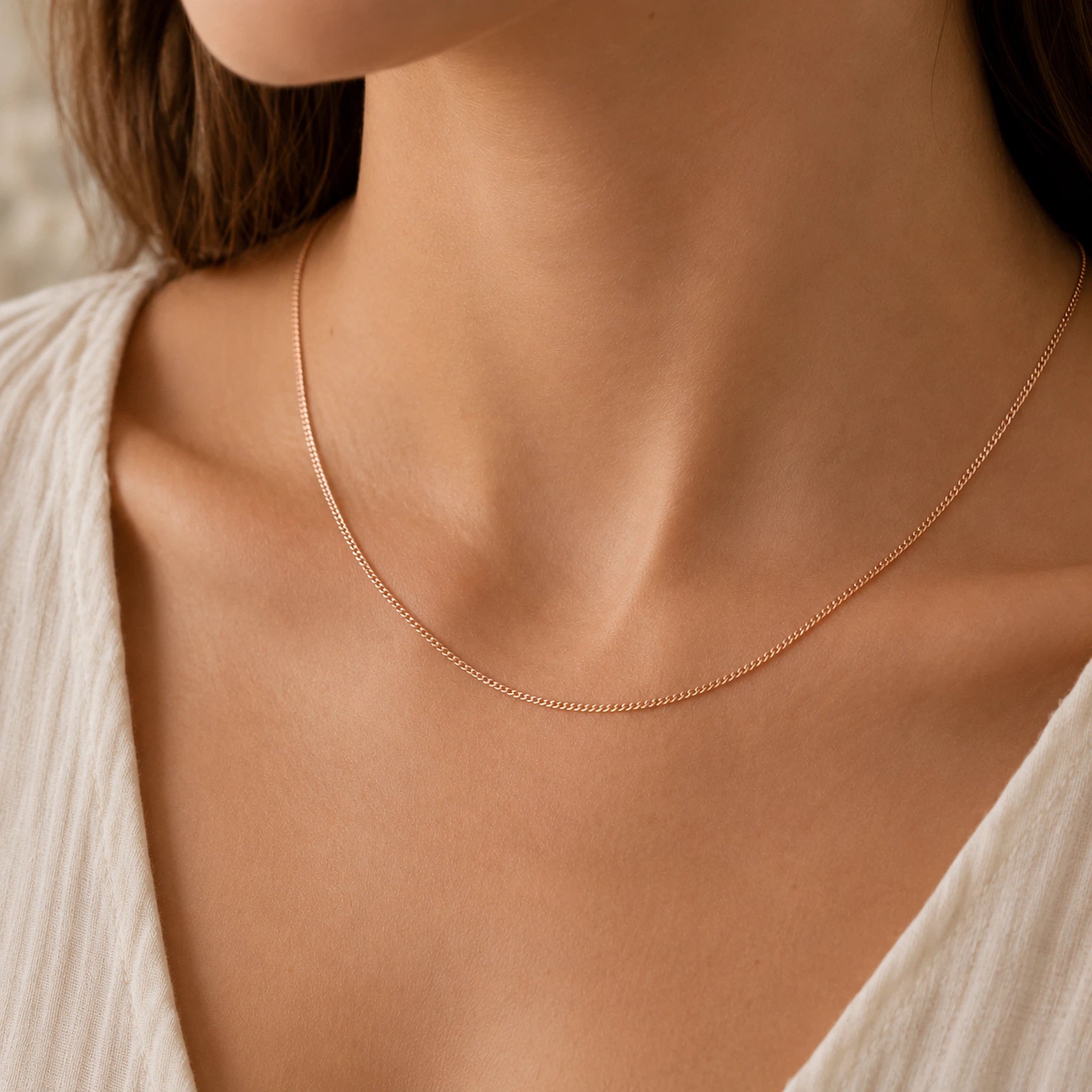 model wearing a minimalist 18k rose gold curb chain necklace
