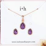 Rose gold jewellery set with tear drop shaped amethyst earrings and necklace 