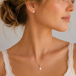 Rose Gold June Birthstone Jewellery worn on a model, featuring a teardrop pendant pearl necklace and matching stud pearl earrings with natural milky white teardrop pearls