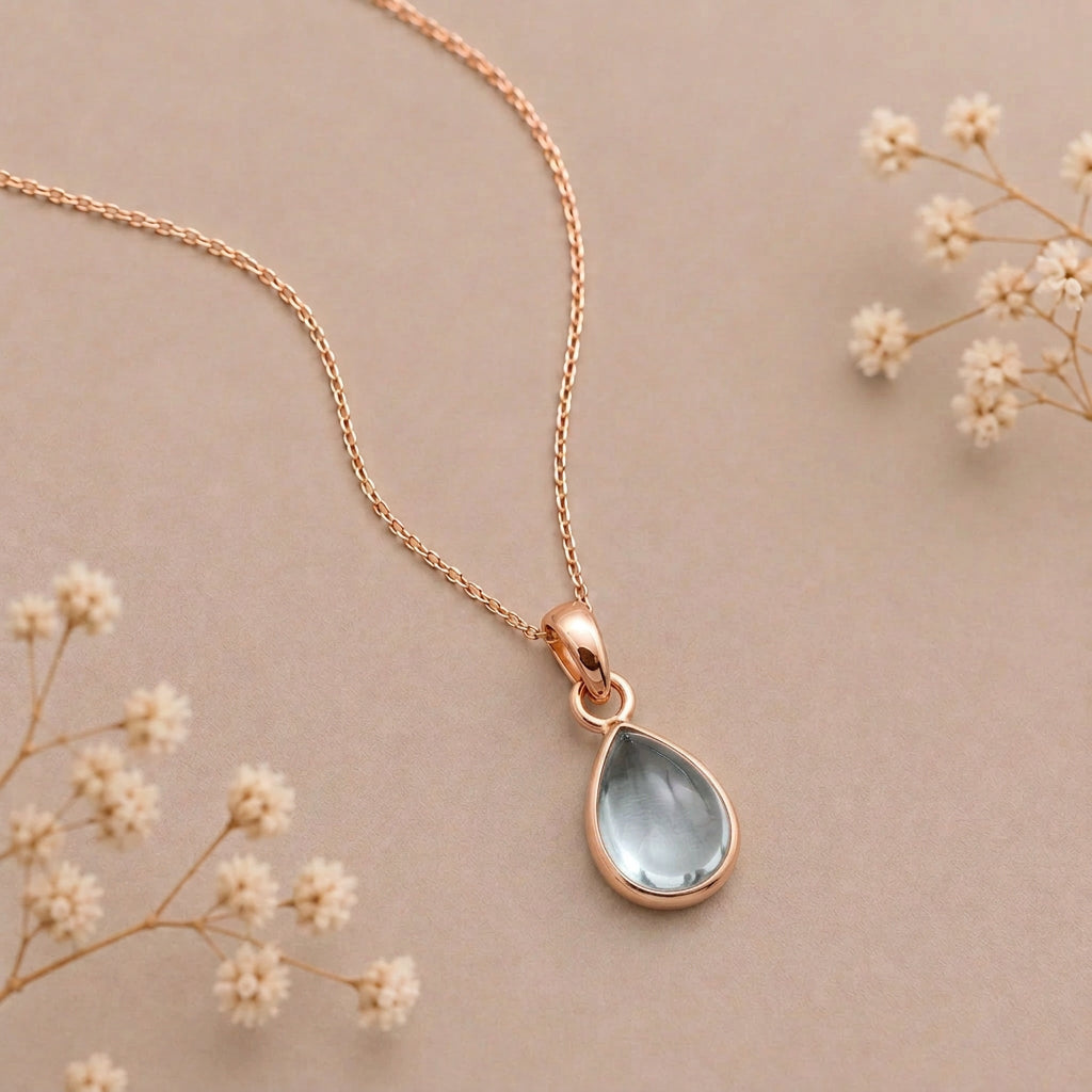 Rose gold March birthstone aquamarine necklace, flat lay