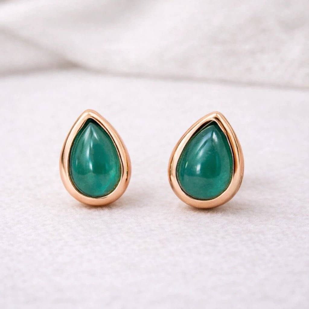 rose gold may birthstone Teardrop-shaped green natural emerald gemstone stud earrings on a white background