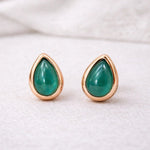 rose gold may birthstone Teardrop-shaped green natural emerald gemstone stud earrings on a white background