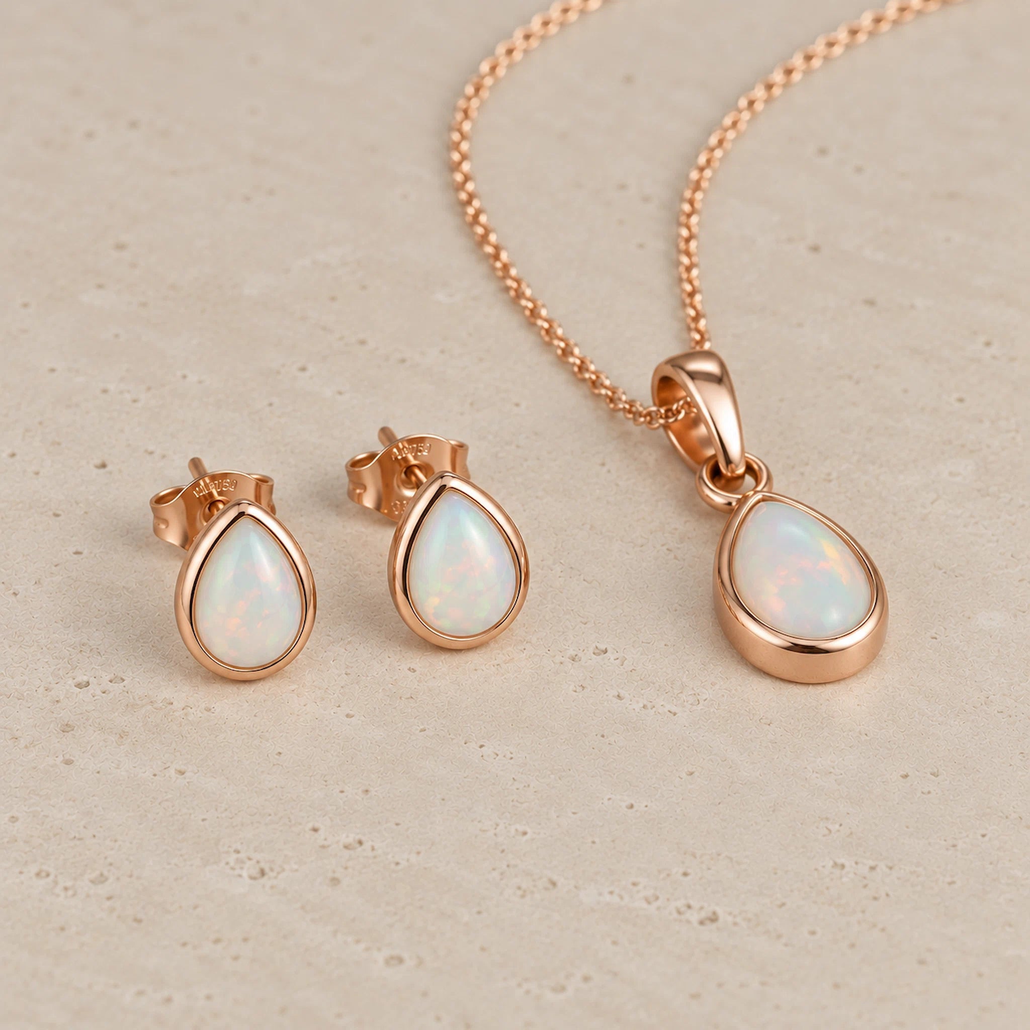 Rose Gold October Birthstone opal Jewellery set including pear-shaped opal stud earrings and opal pendant necklace