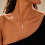 Model wearing a rose gold October birthstone opal necklace