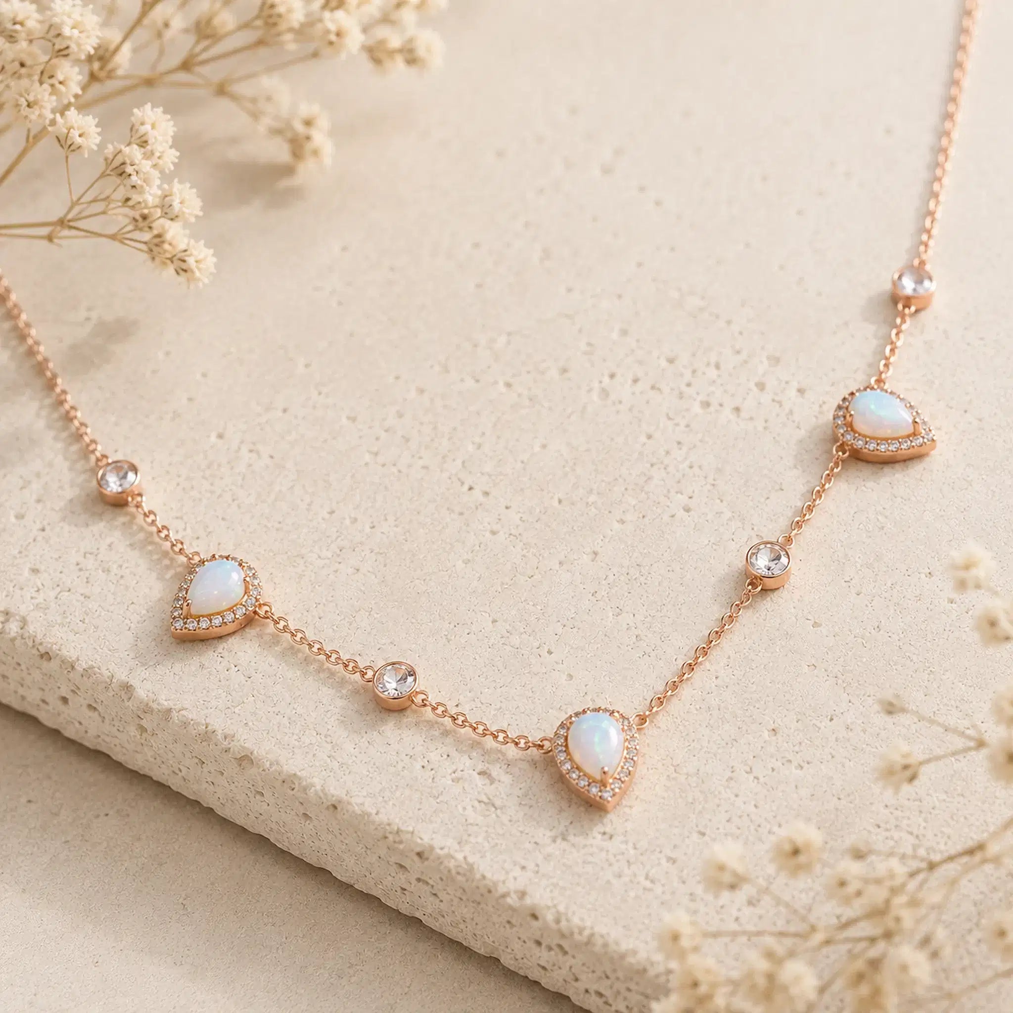 rose gold necklace with lab-grown white opals and CZs