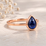 September Birthstone Natural Sapphire Ring - A rose gold ring featuring a teardrop-shaped deep blue gemstone