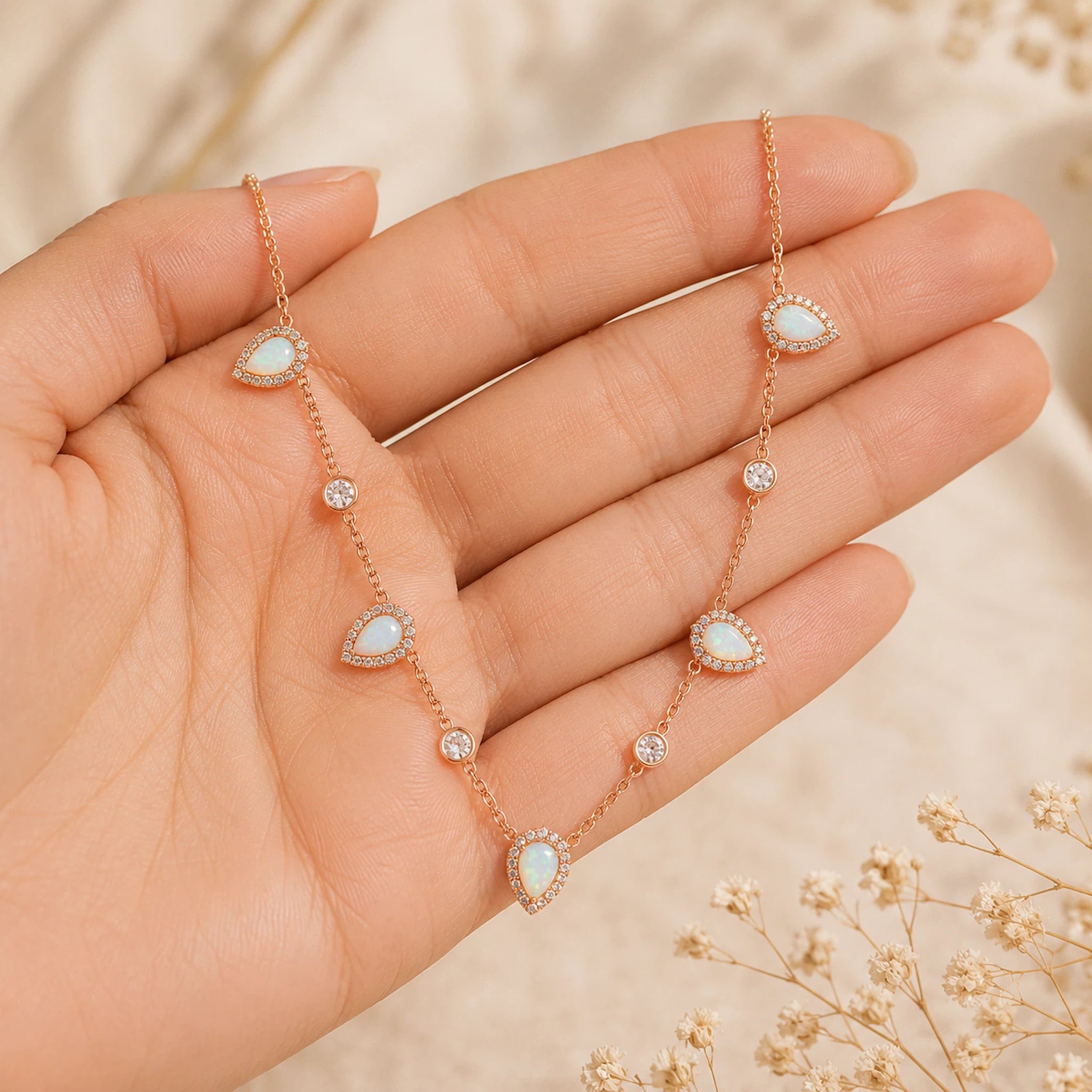rose gold necklace held with opals and csz