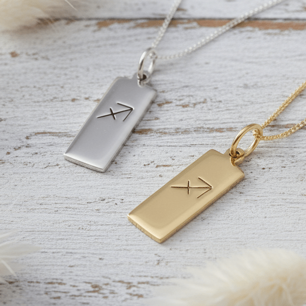 Silver and gold necklaces with hand drawn Sagittarius star sign symbol