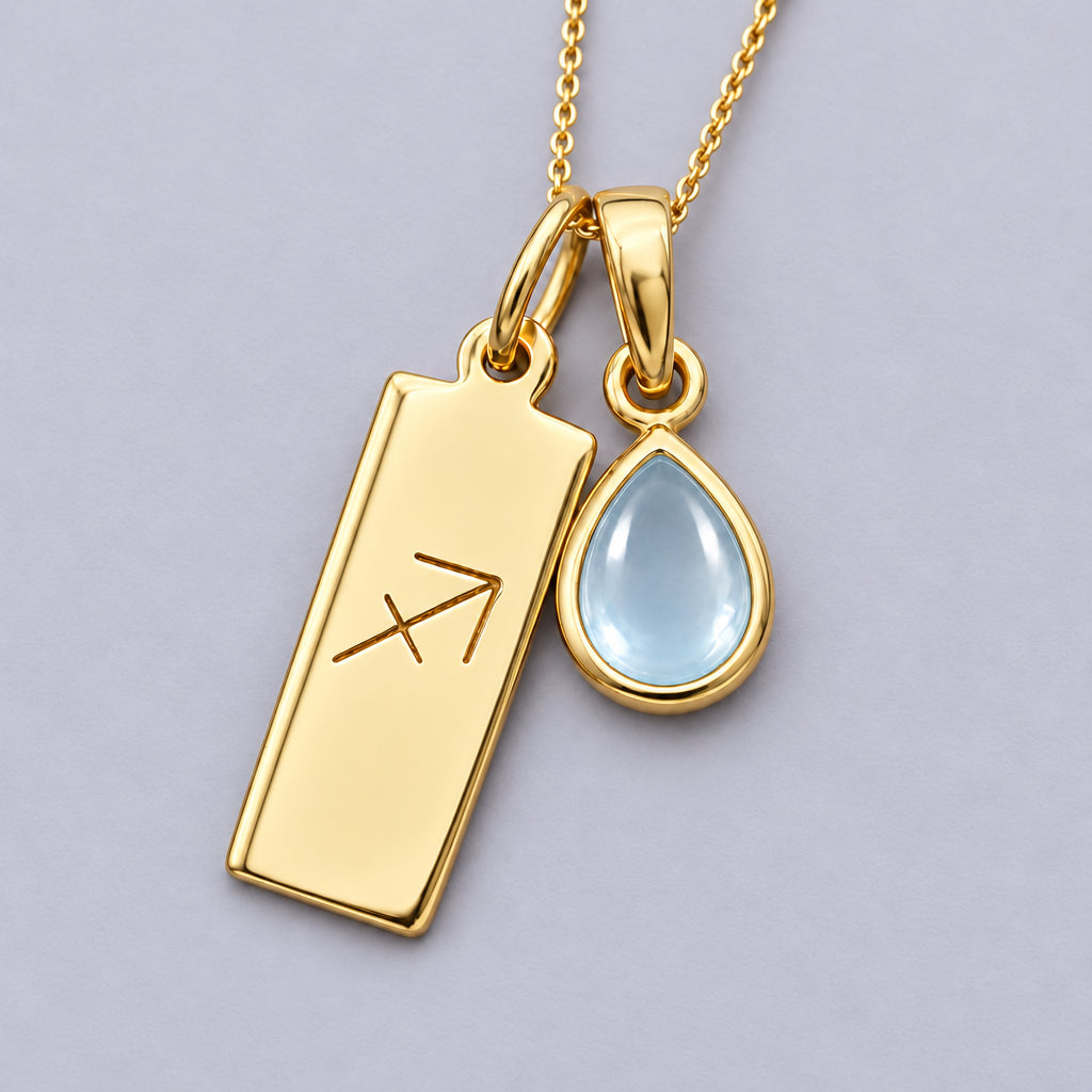 Gold Sagittarius zodiac bar and November topaz teardrop, close-up