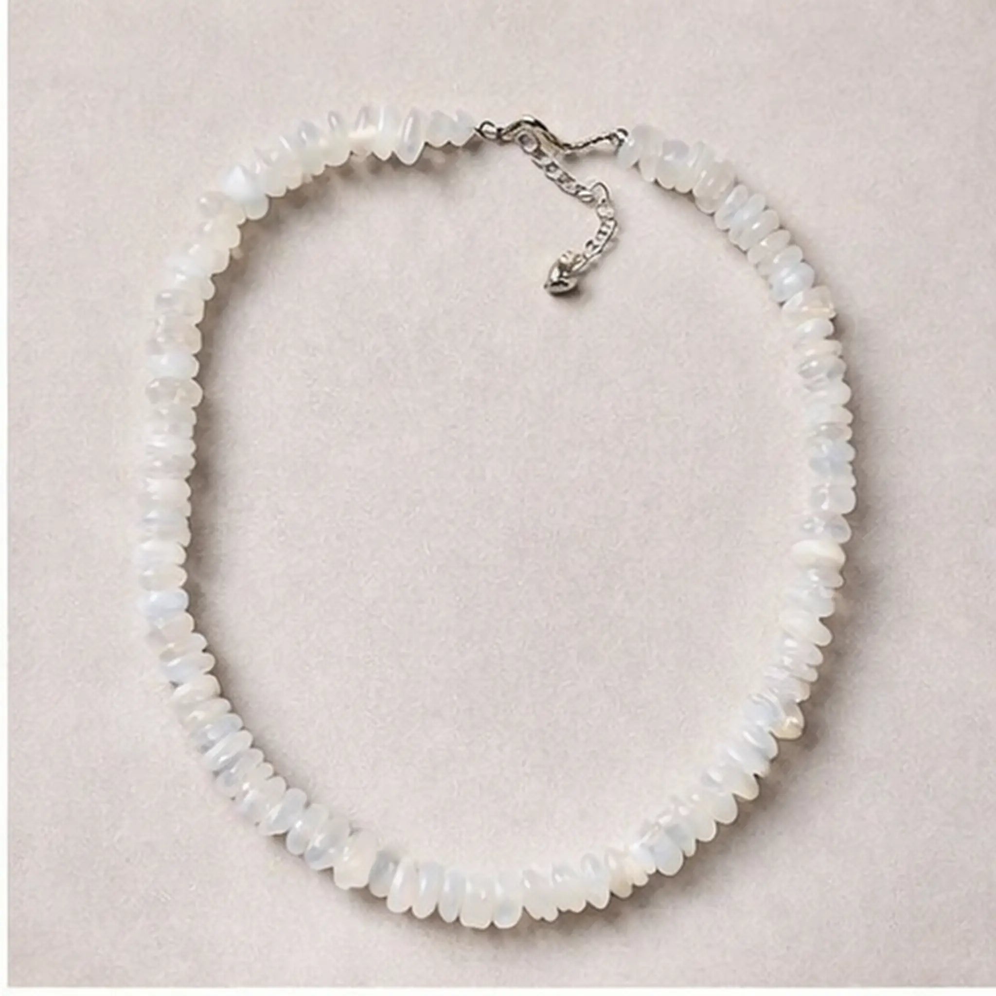 Signature Moonstone Necklace flat lay showing full beaded design and length