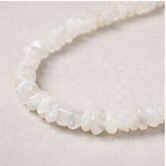 Close-up of moonstone beads with soft translucent finish on Signature Moonstone Necklace