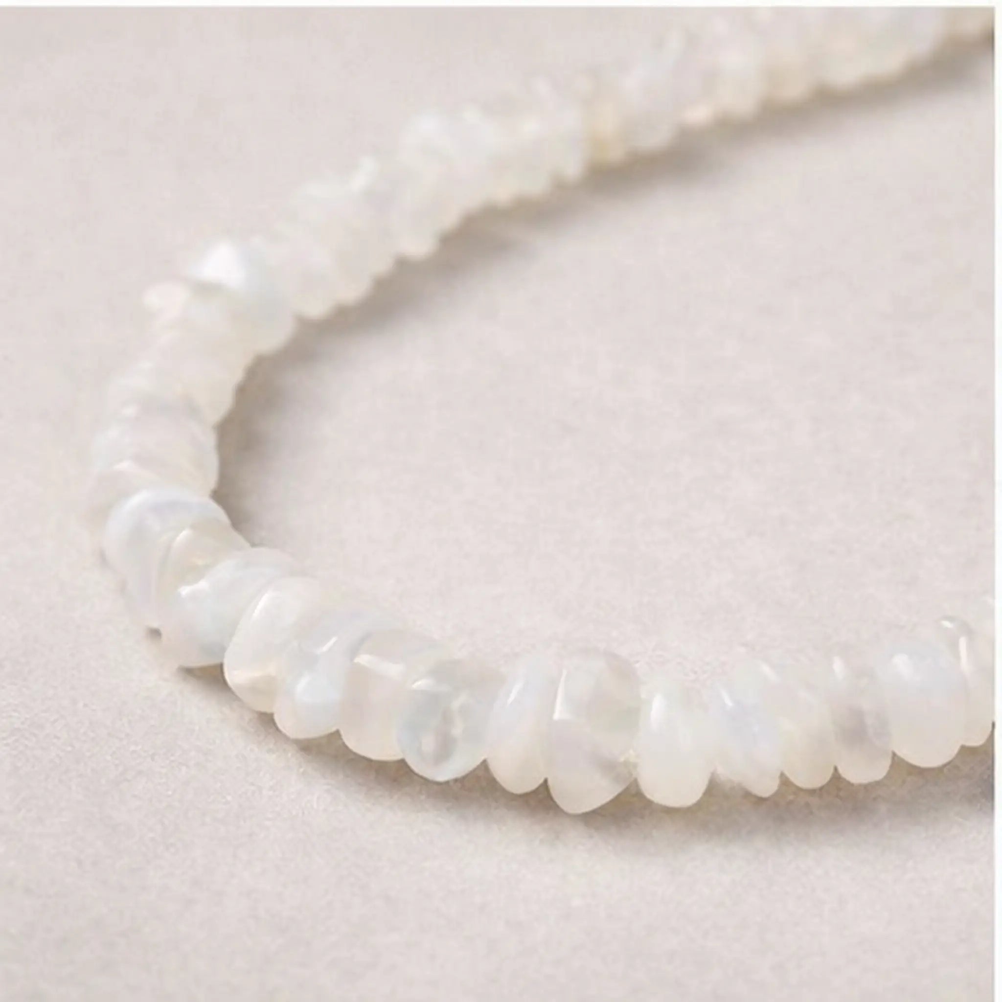 Close-up of moonstone beads with soft translucent finish on Signature Moonstone Necklace