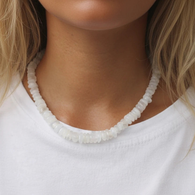 Signature Moonstone Necklace worn on the neck with smooth white moonstone beads