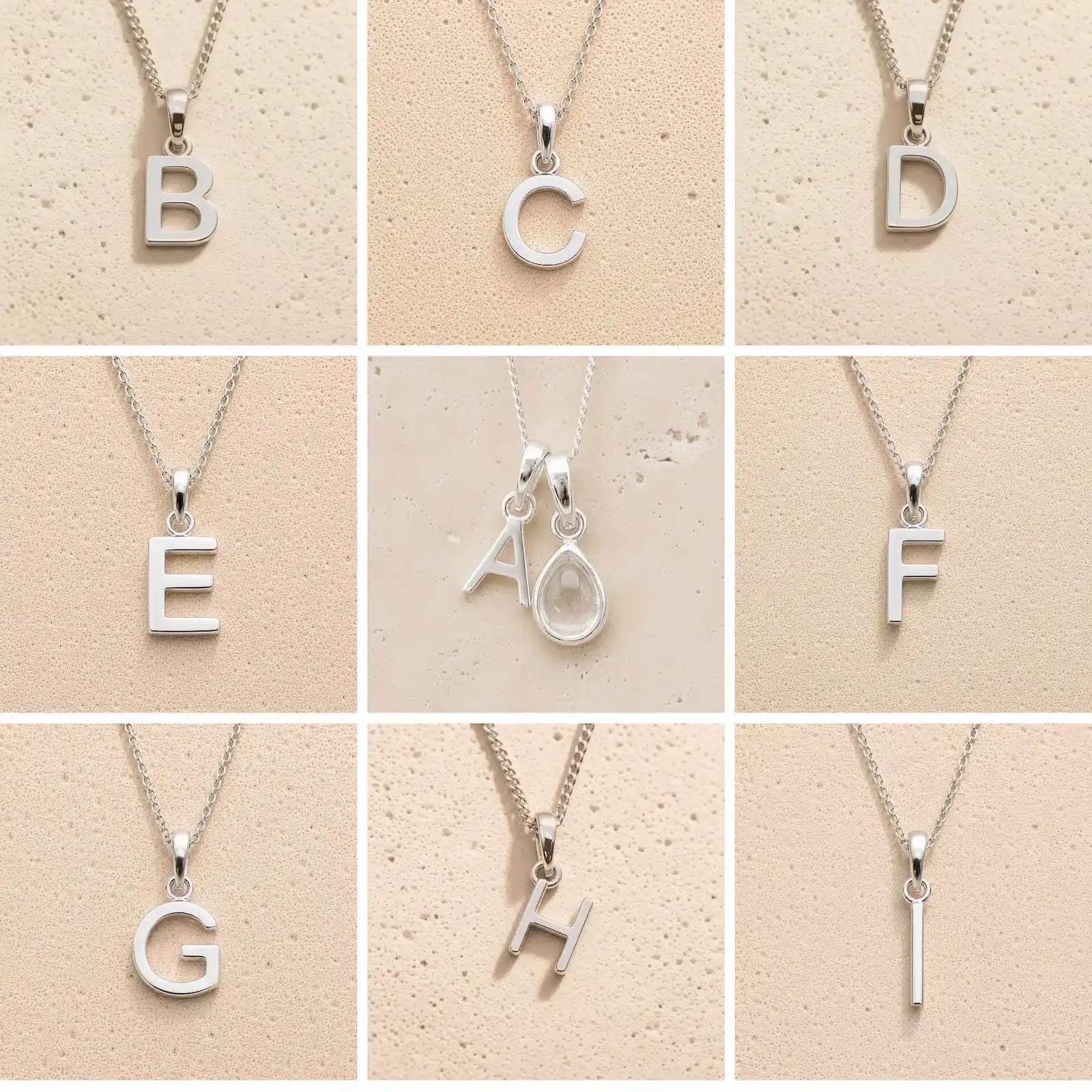 Collection of silver letter necklaces A to I on a beige background as initial options for a personalised April Birthstone Clear Quartz Necklace.