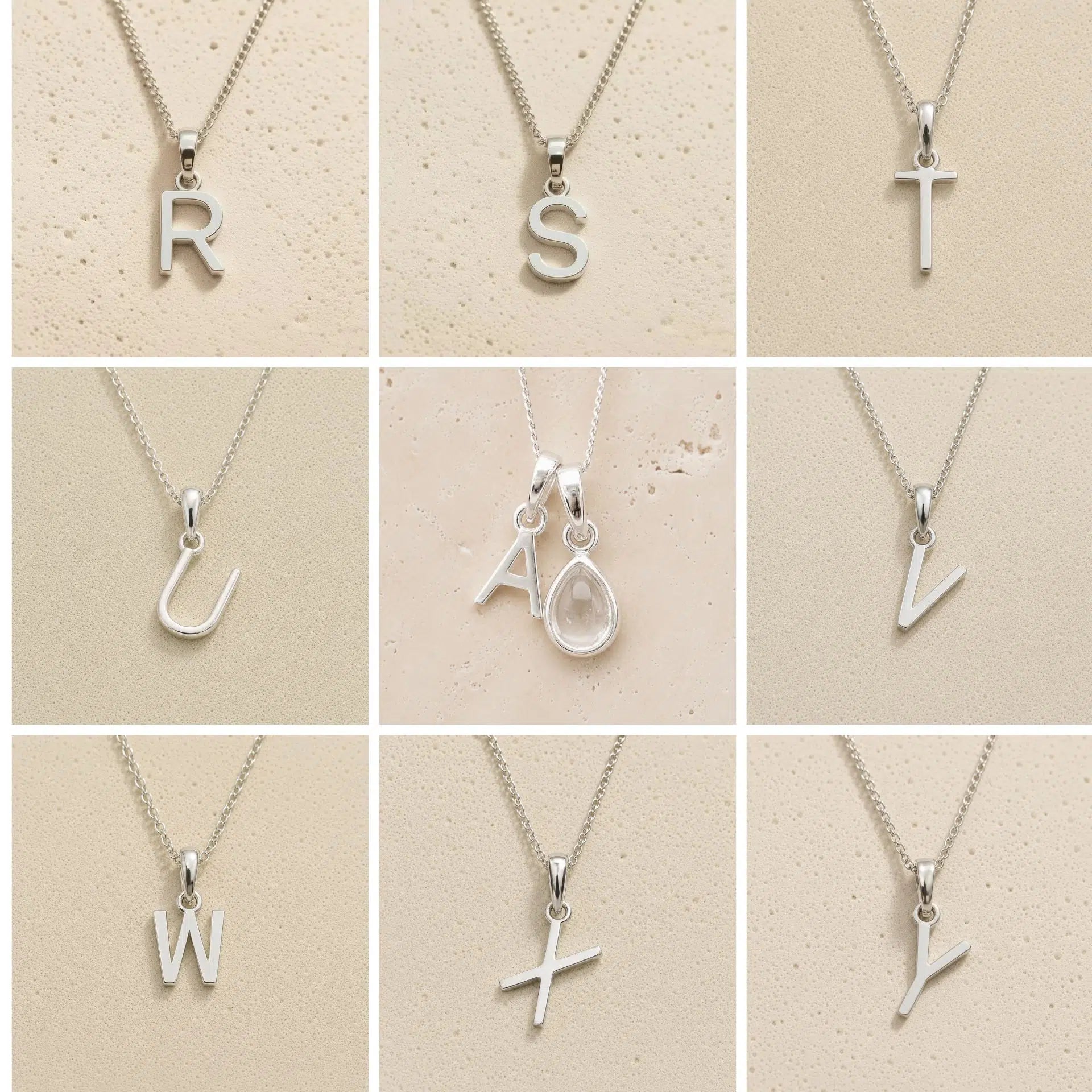 Collection of silver letter necklaces R to Z on a beige background as initial options for a personalised April Birthstone Clear Quartz Necklace.