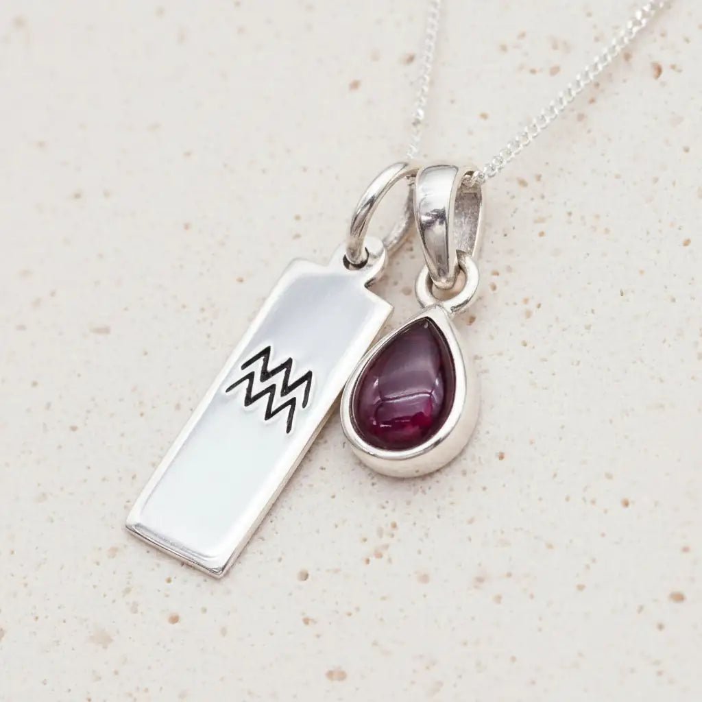 Sterling Silver January Birthstone Necklace with a pear-shaped natural Garnet gemstone pendant and Aquarius Zodiac pendant