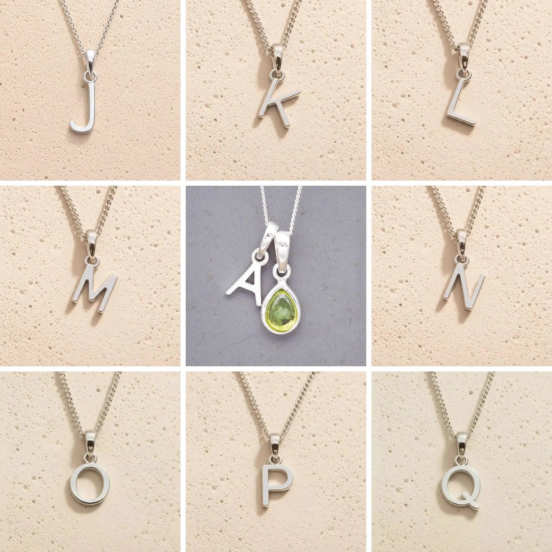 Collection of silver letter necklaces J to Q on a beige background, as initial options to customise August Birthstone Peridot Necklace.