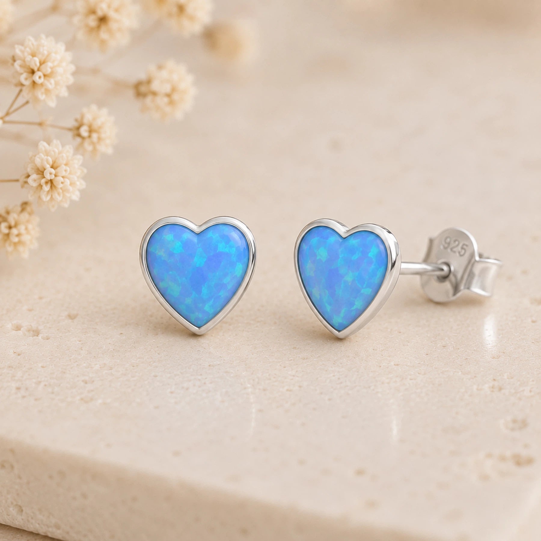 sterling silver stud earring with blue opal heart