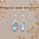 silver french hook earrings with faceted marquise natural blue topaz gemstones