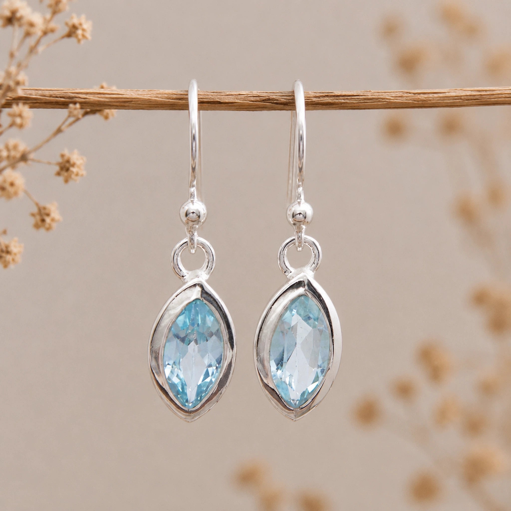 silver french hook earrings with faceted marquise natural blue topaz gemstones