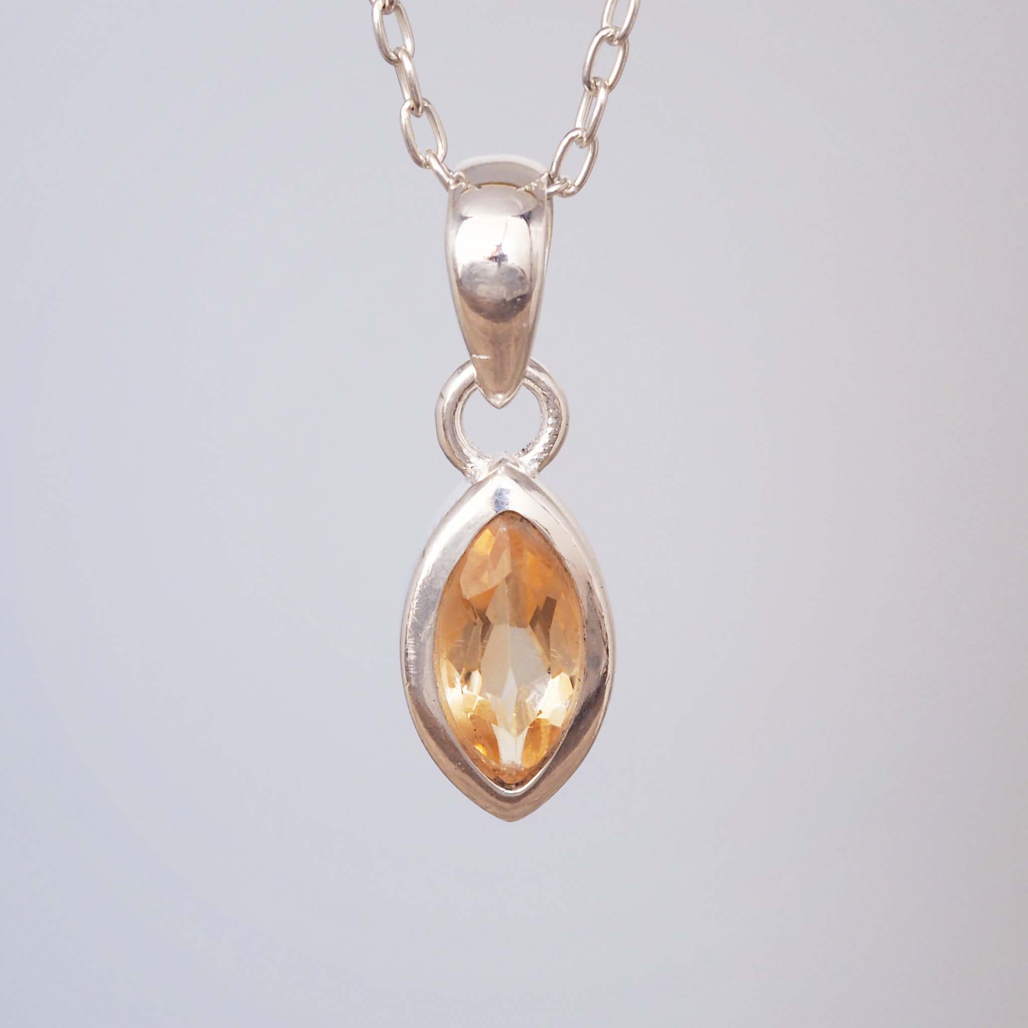 sterling silver citrine necklace with natural faceted marquise shaped citrine gemstone in minimalist boho design