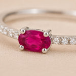 close up image of sterling silver ruby Ring on a beige background