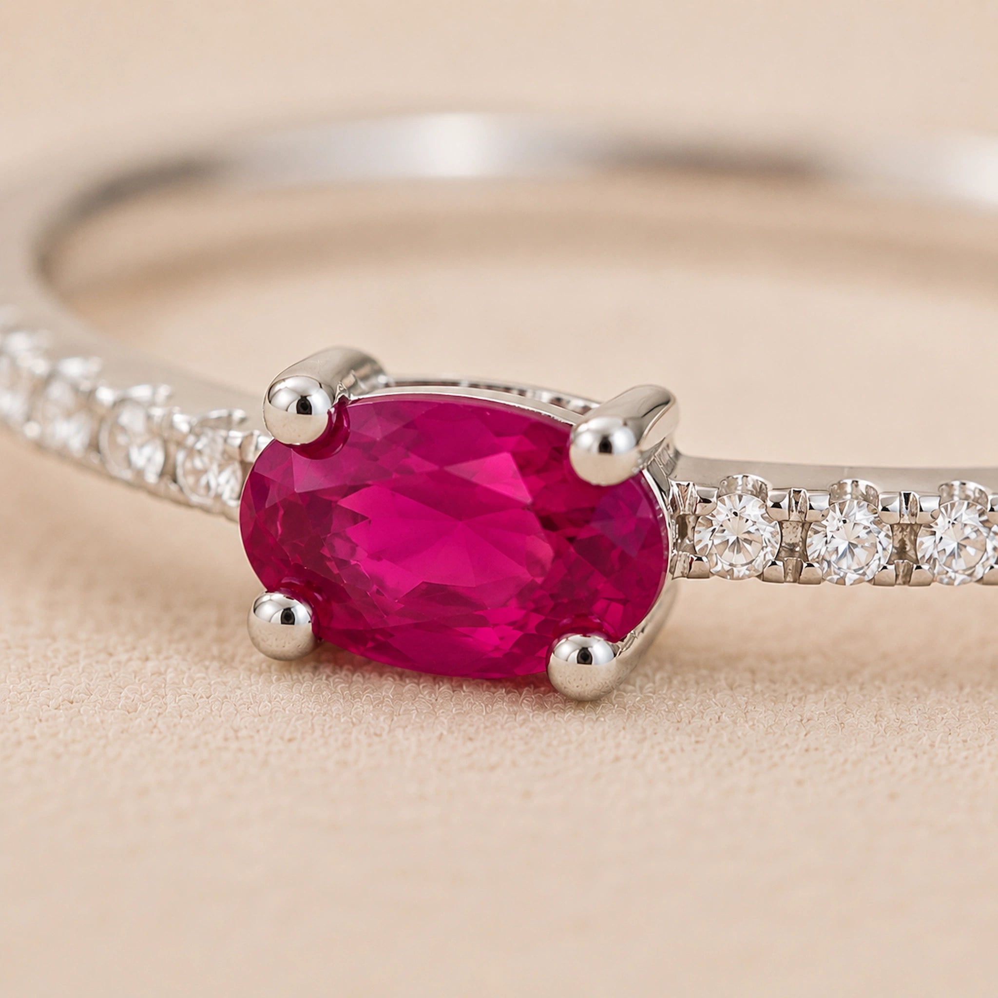 close up image of sterling silver ruby Ring on a beige background