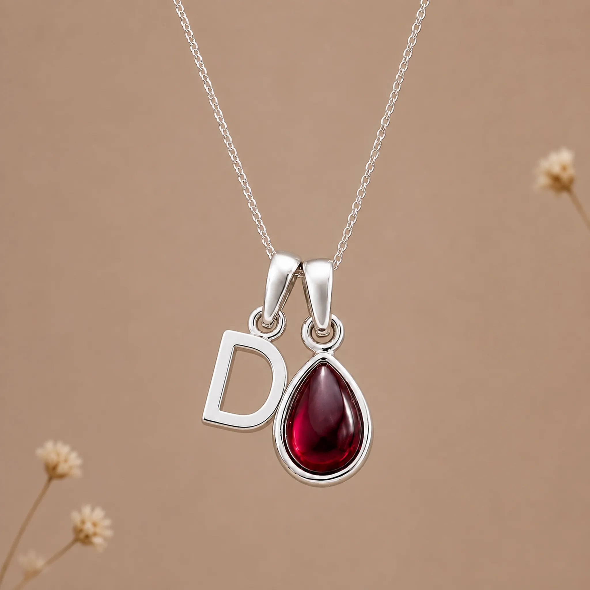 Sterling silver initial D necklace with a natural January garnet