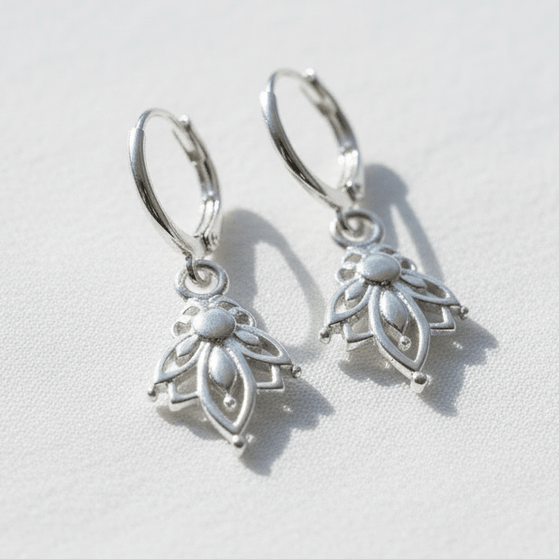 Silver hoop earrings with lotus pendants 