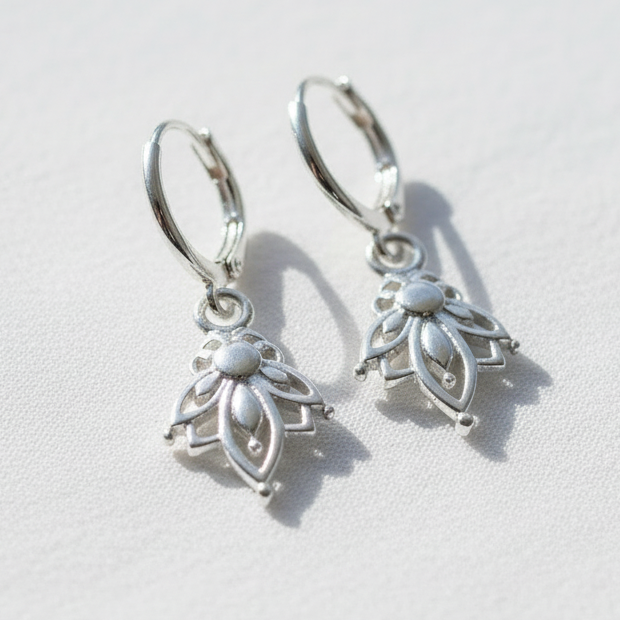 Silver hoop earrings with lotus pendants 