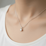 Necklace with an opal pendant on a mannequin