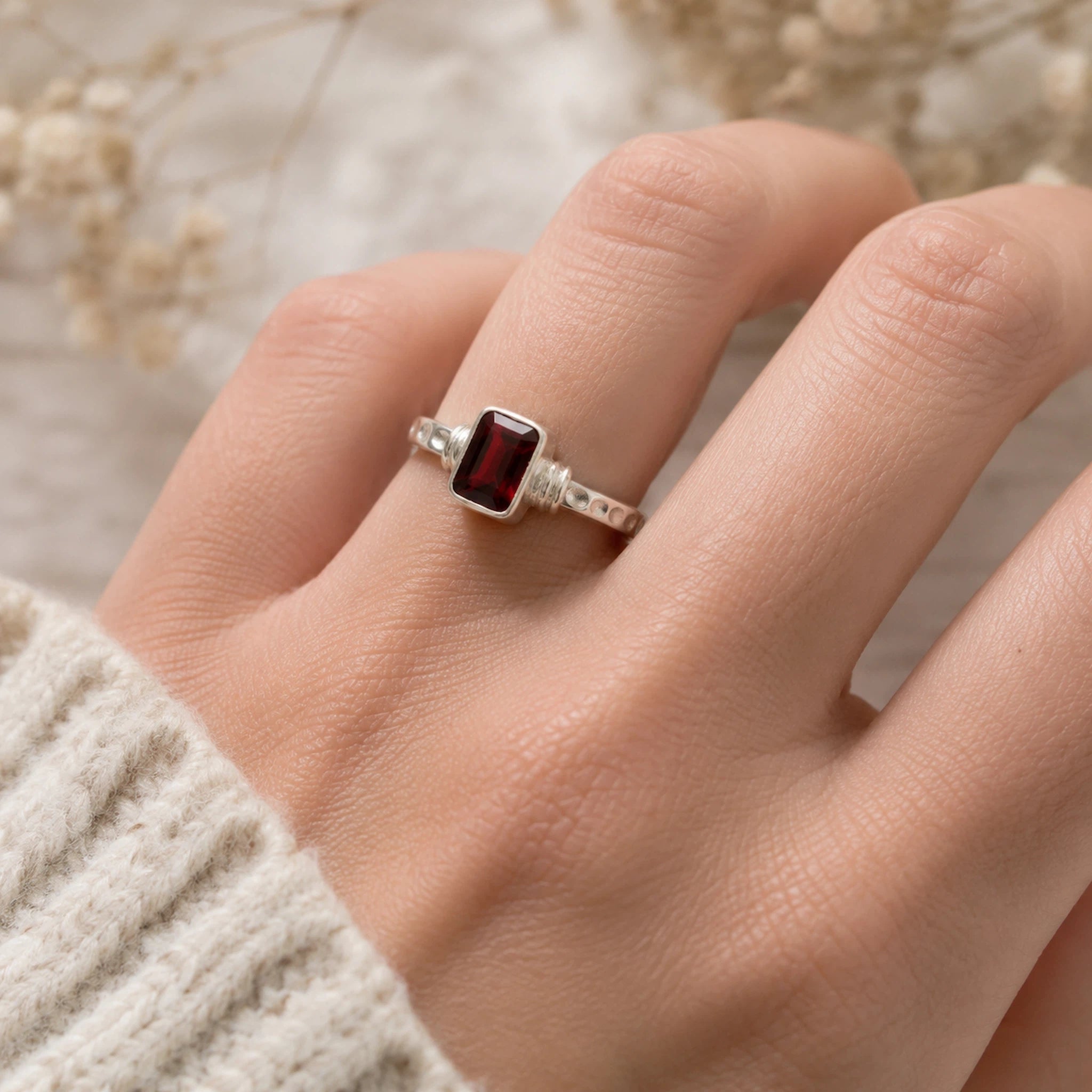 Sterling Silver Emerald-Cut Natural Garnet Gemstone Ring being worn on a finger