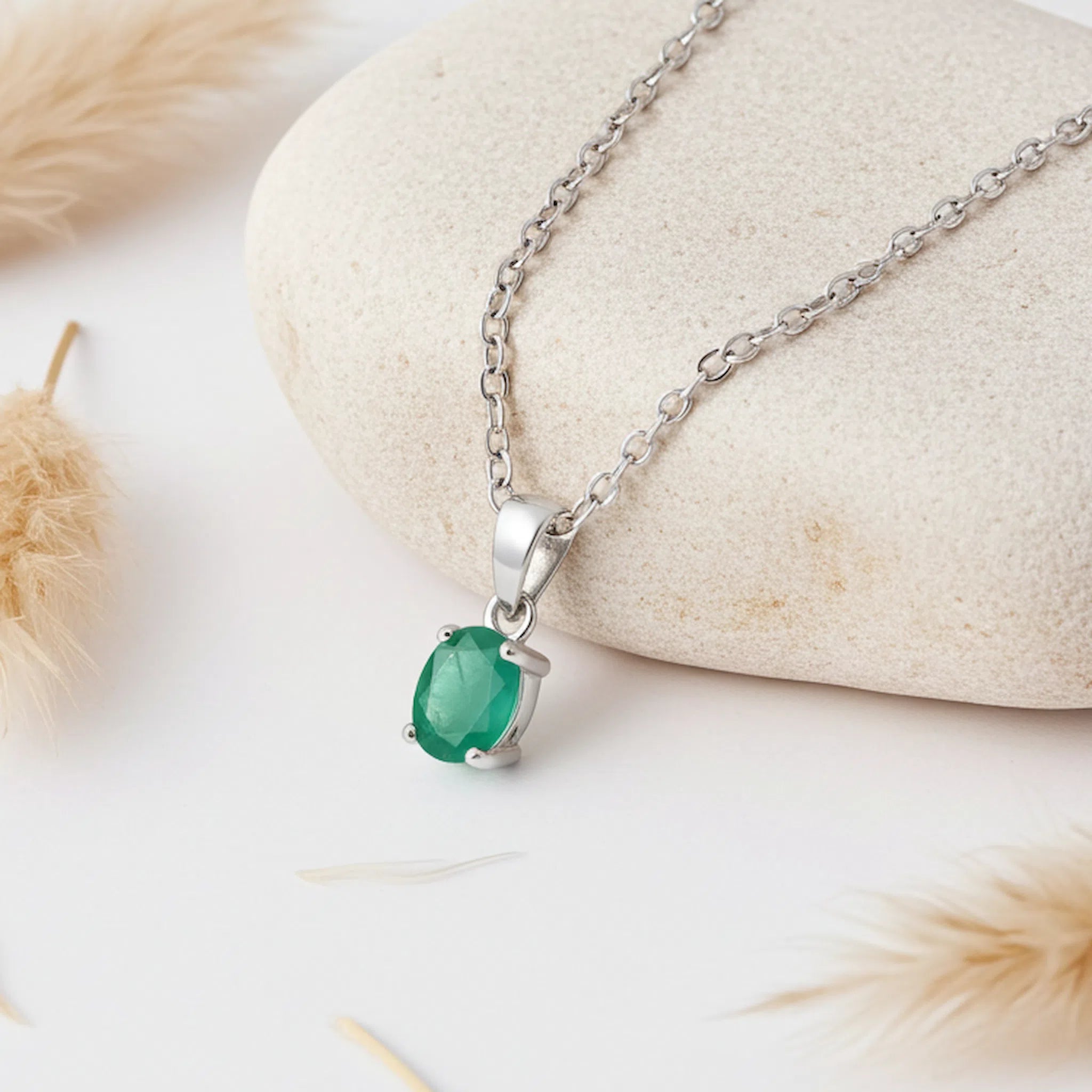 sterling silver chain necklace with faceted claw set natural oval emerald gemstone pendant
