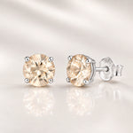 Light Silk crystal stud earrings in sterling silver four-claw settings