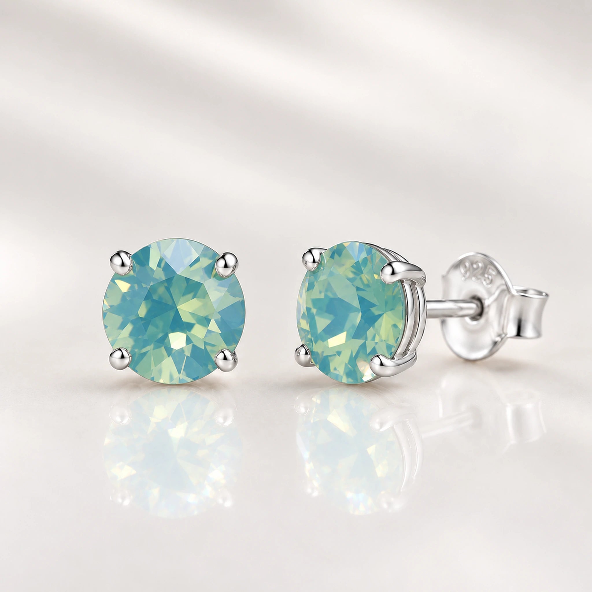 Pacific Opal crystal stud earrings in sterling silver four-claw settings